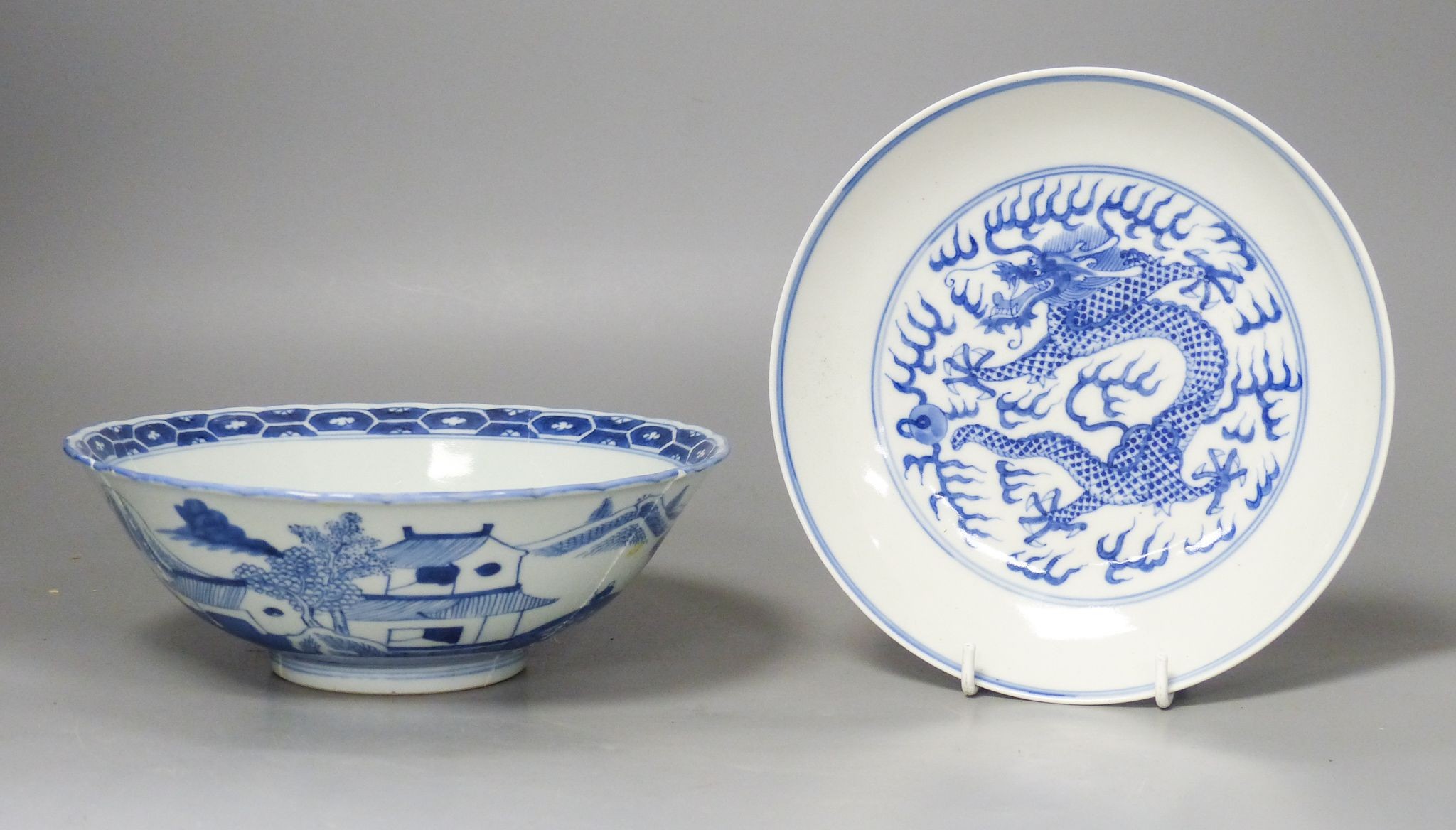 A Chinese blue and white landscape bowl, a/f and a Chinese blue and white ‘dragon’ dish, 18 and 16.5 cm